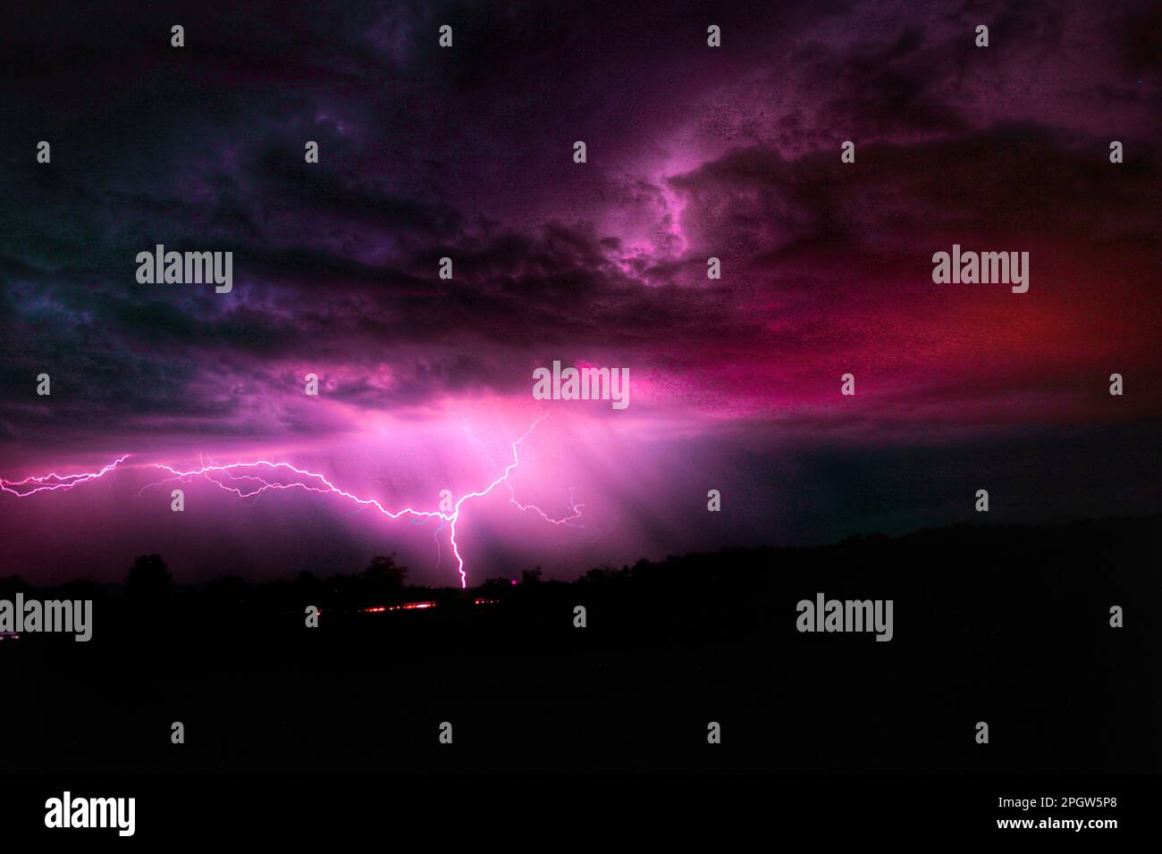 A dramatic night sky with a flash of lightning illuminating the dark