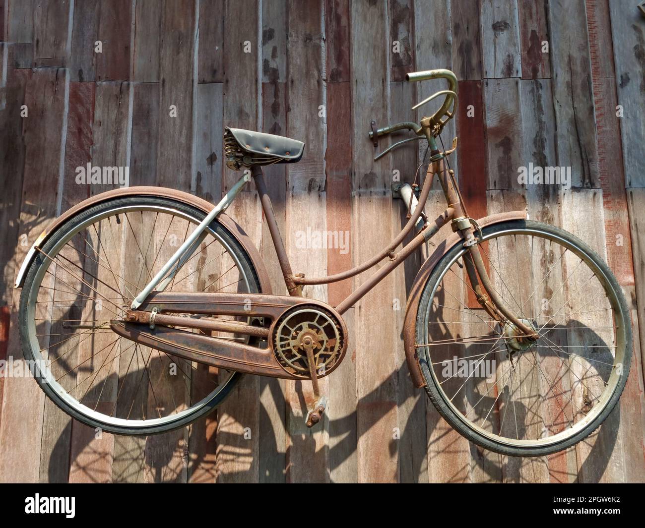 Old bicycle hanging on the wall Stock Photo Alamy