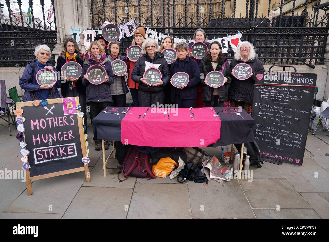 Christiana Figueres (front row third right), the executive secretary of the United Nations Framework Convention on Climate Change (UNFCCC) joins a group of hunger striking mothers, on the last day of their hunger strike over food poverty and climate change, at Carriage Gate outside Parliament in London. Picture date: Friday March 24, 2023. Stock Photo