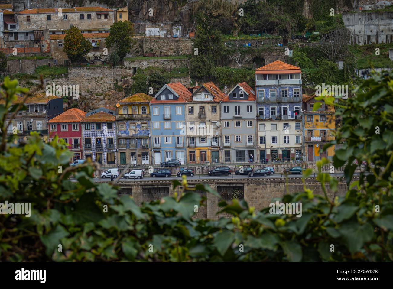 Porto, Portugal - 13th March 2023: Colorful facades of houses on the banks of the Douro river, avenue Gustavo Eiffel Stock Photo