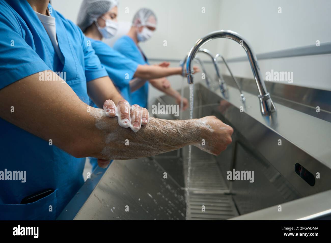 Team of surgeons washes their hands before the operation Stock Photo