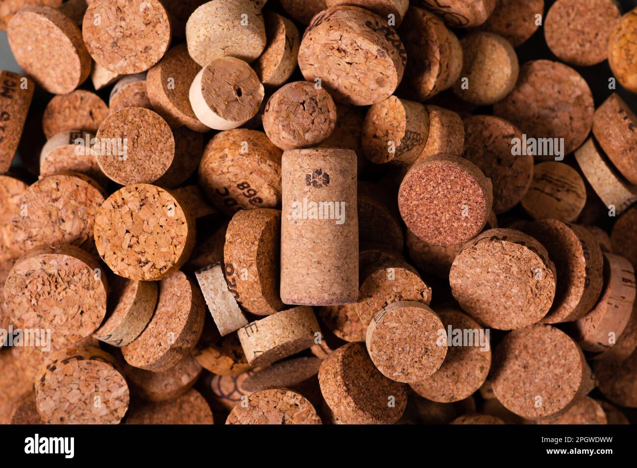 Recycling symbol and wine cork for secondary use. Preservation of the