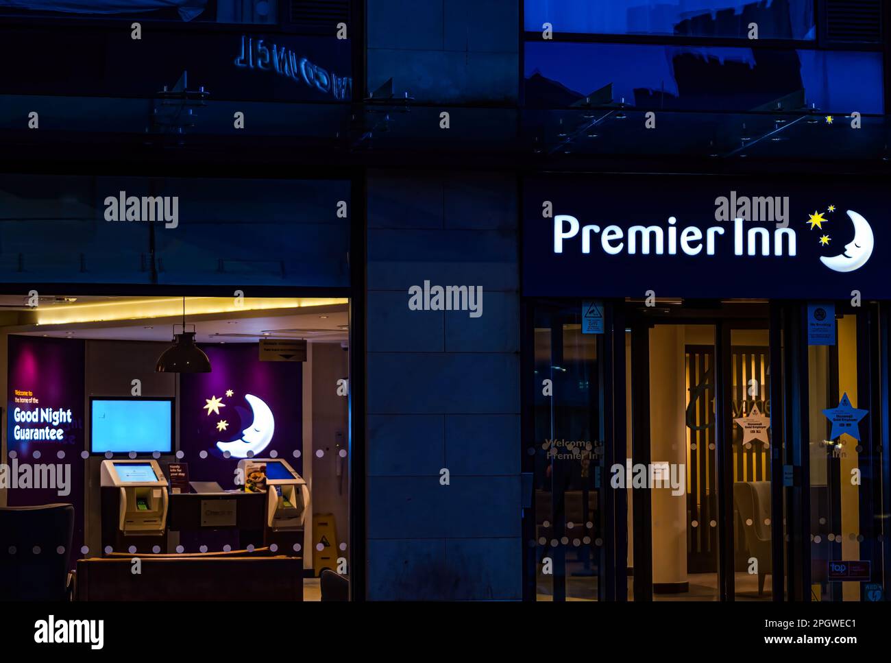 Premier Inn neon sign lit up at night, Edinburgh, Scotland, UK Stock Photo