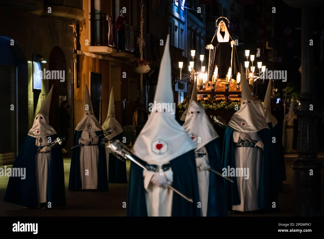 Gandia, Spain -  16 April 2022: Easter procession with Mary sculpture at a float at night at Good Friday Stock Photo