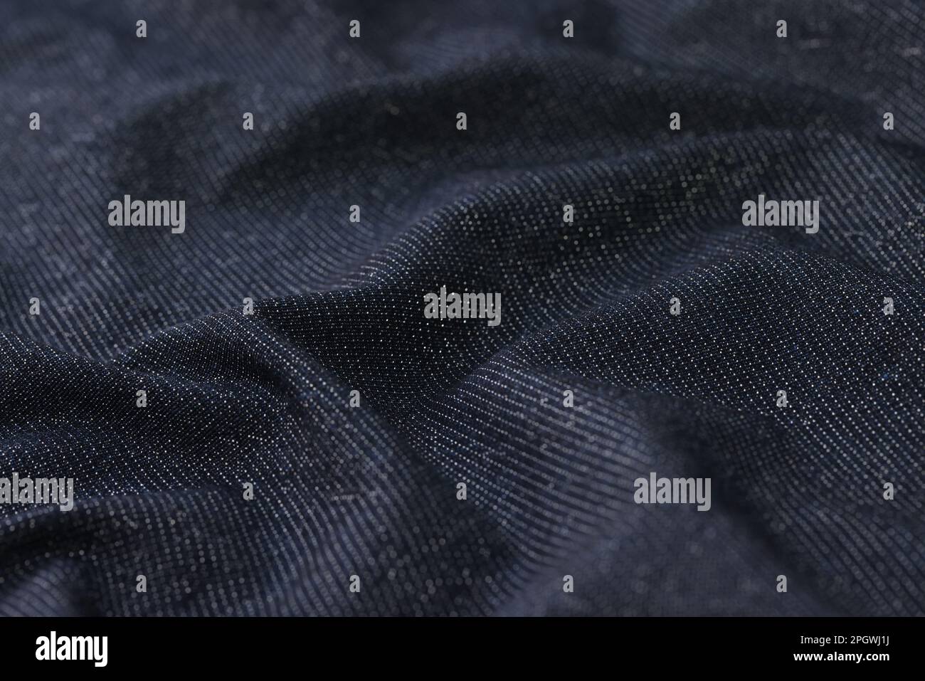 Crumpled dark grey dense fabric for clothes sewing Stock Photo