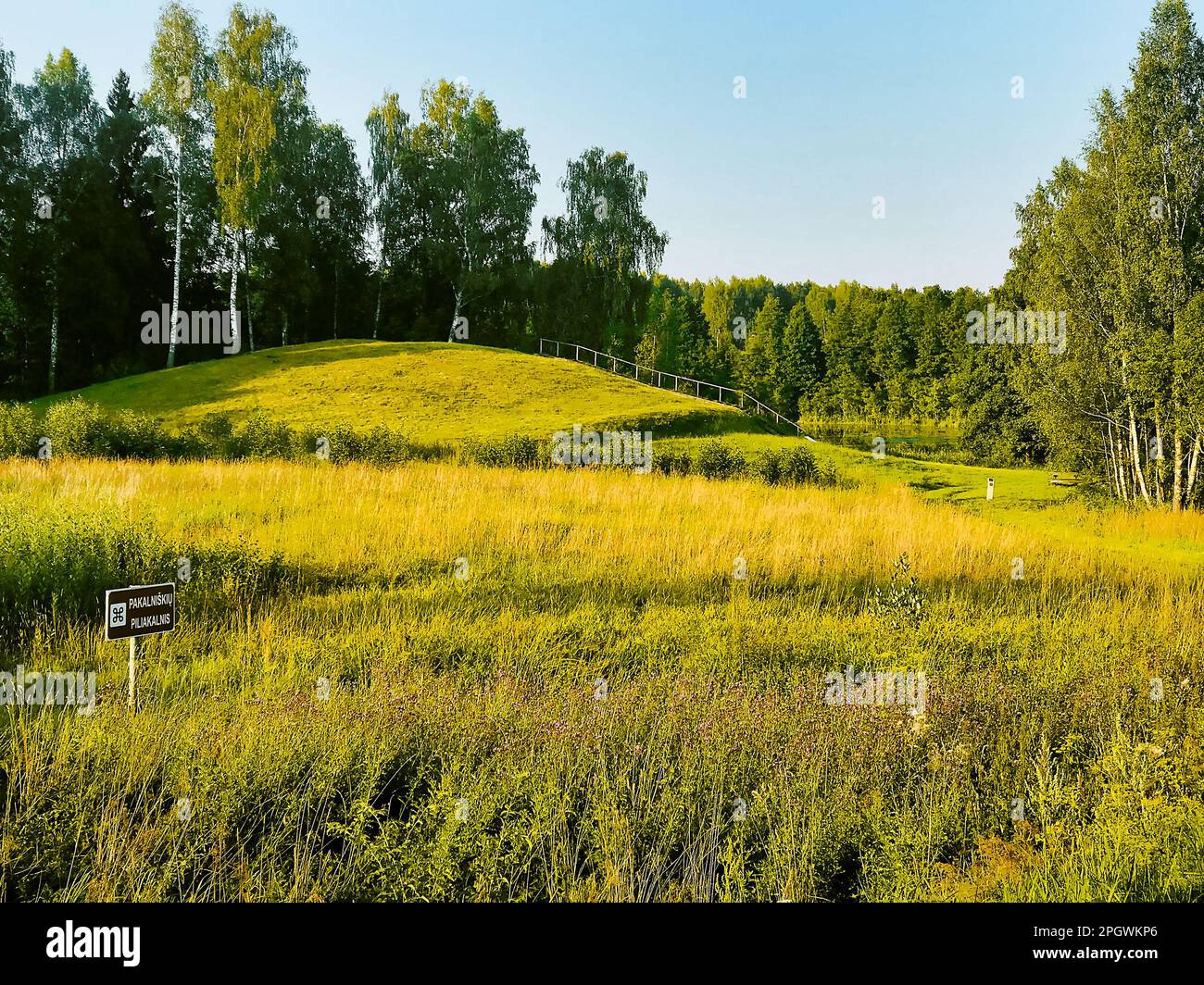 Typical mounds in summer Lithuania countryside. Famous formation to visit in tranquil countryside Baltics Stock Photo