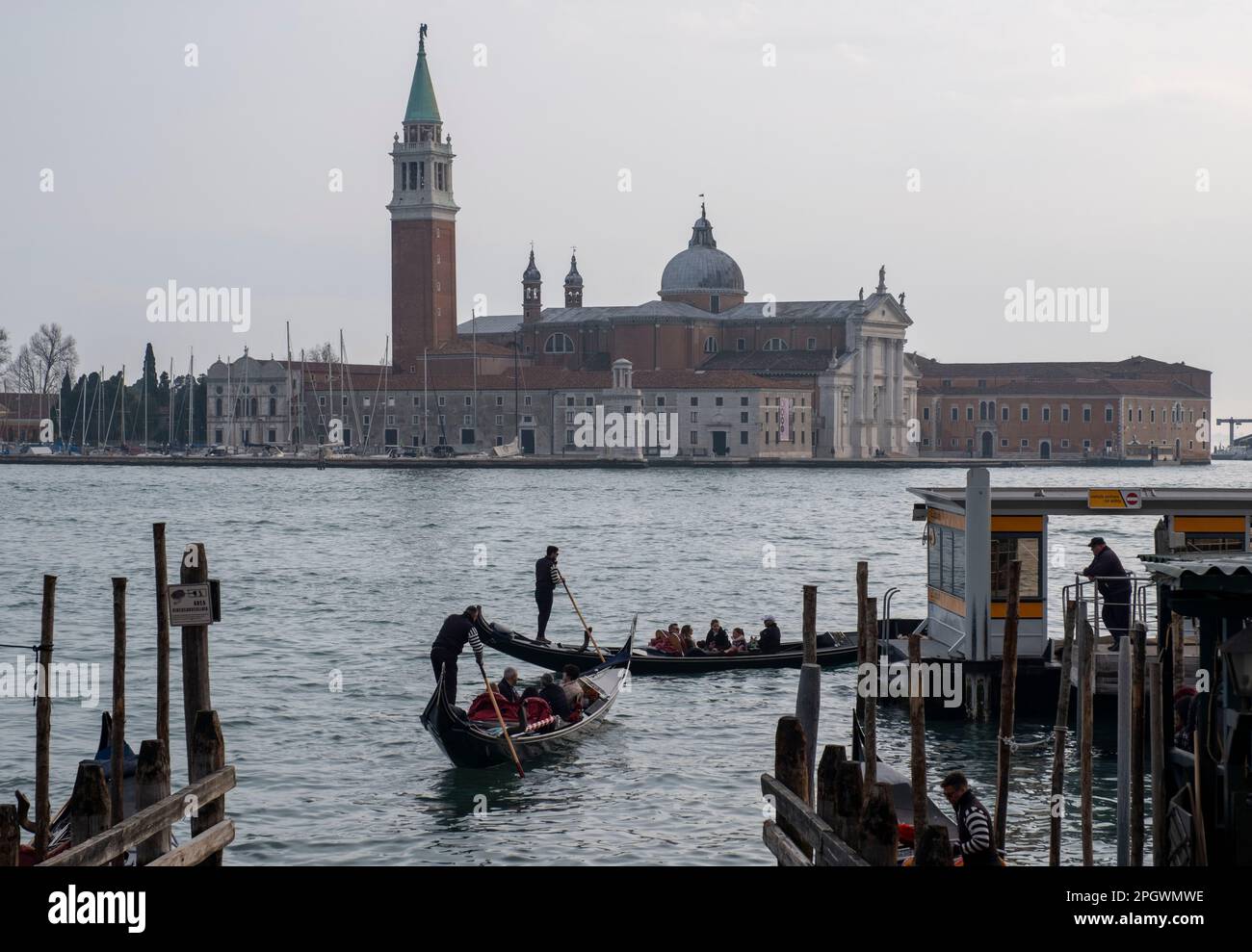 Gondoliers working on the Grand Canal at San Marco, Venice, Italy Stock Photo