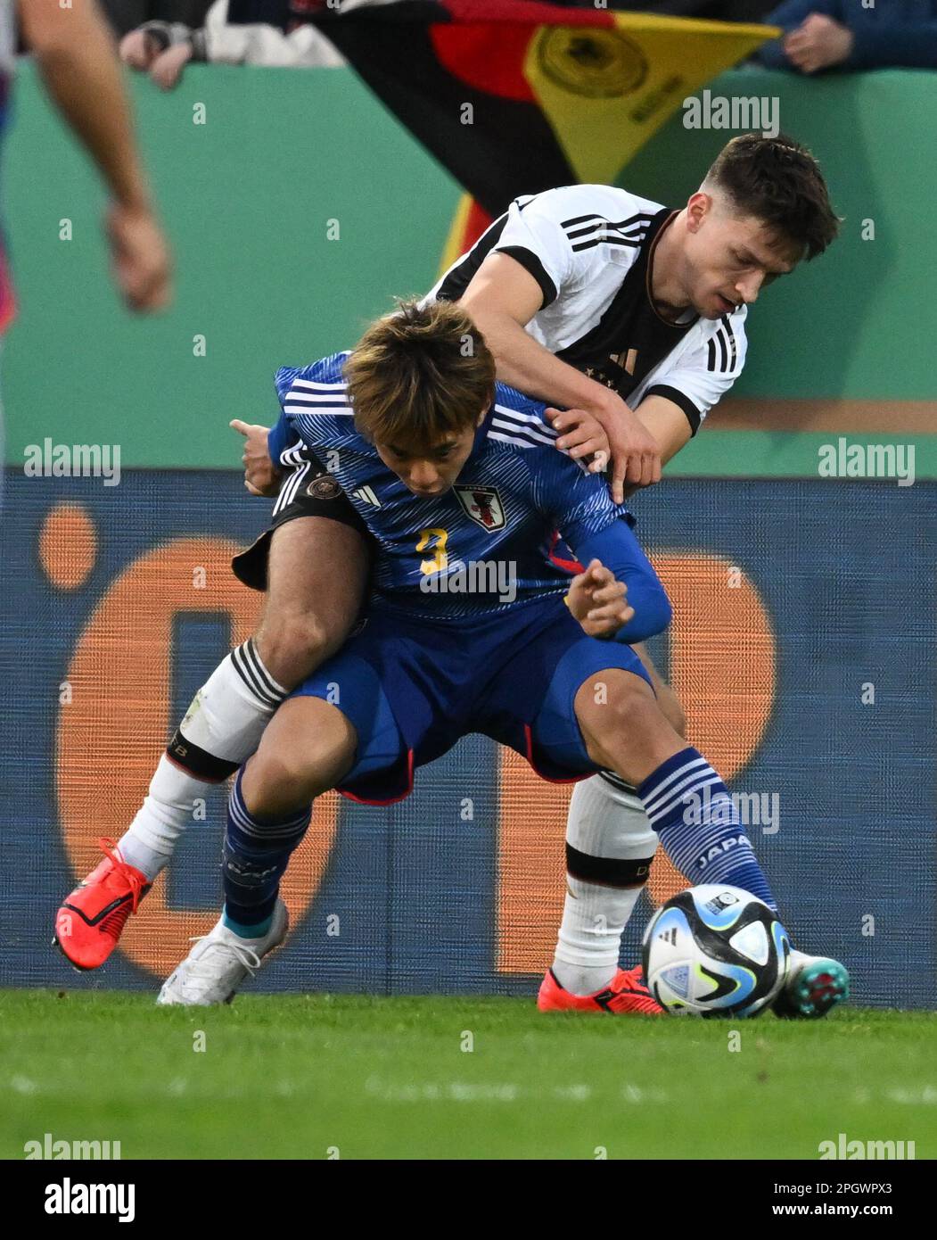 24 March 2023, Hesse, Frankfurt/Main: Soccer, U21 Men: Internationals, Germany - Japan, PSD Bank Arena. Germany's Noah Katterbach (back) and Japan's Rihito Yamamoto fight for the ball. Photo: Arne Dedert/dpa Stock Photo