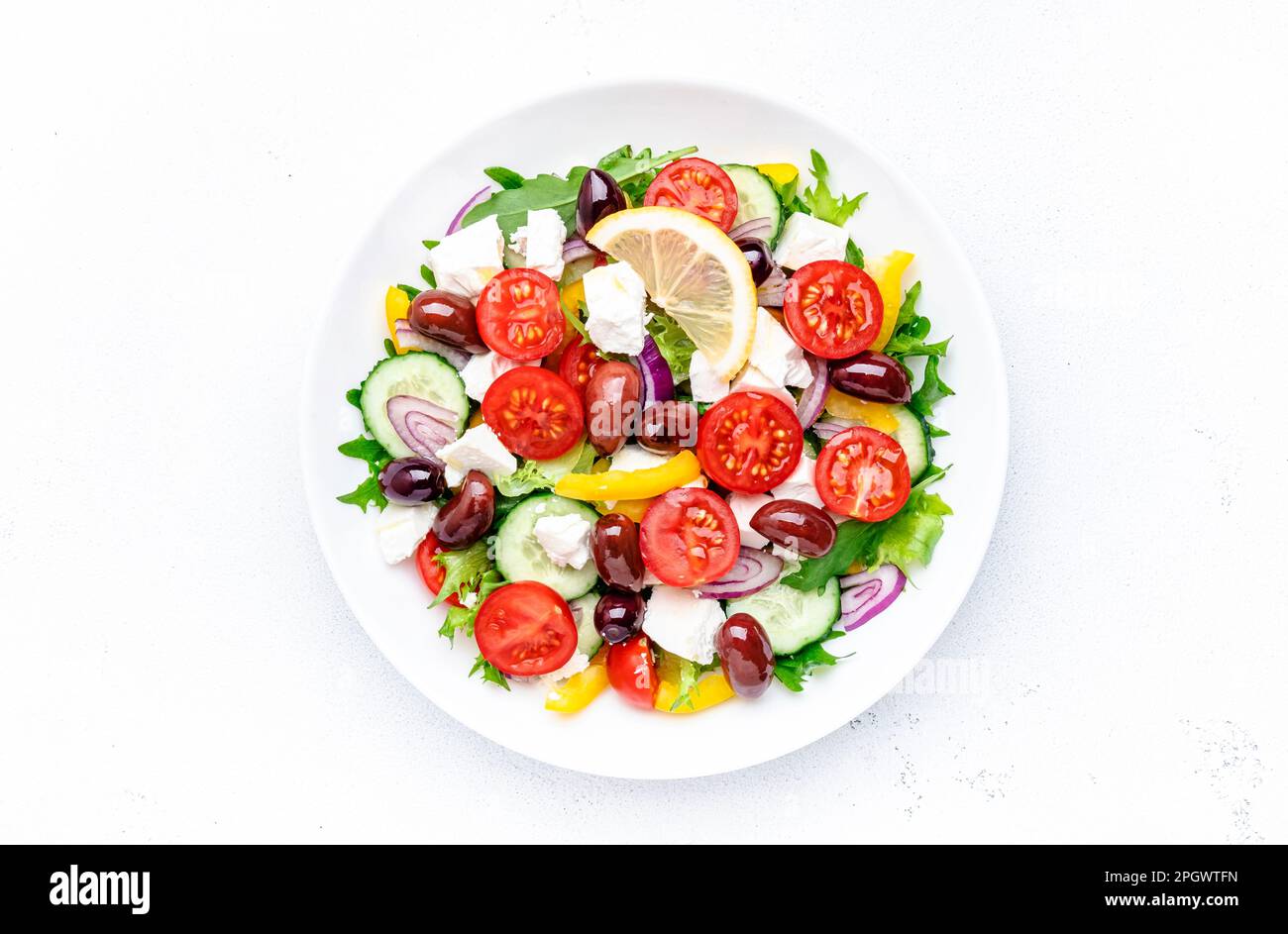 Greek salad with feta cheese, kalamata olives, cherry tomato, yellow
