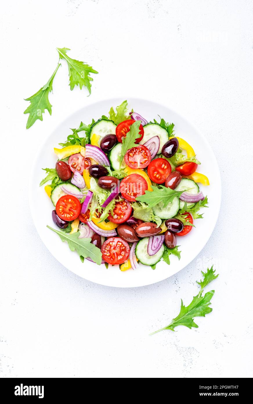 Vegan greek salad with kalamata olives, cherry tomato, yellow paprika