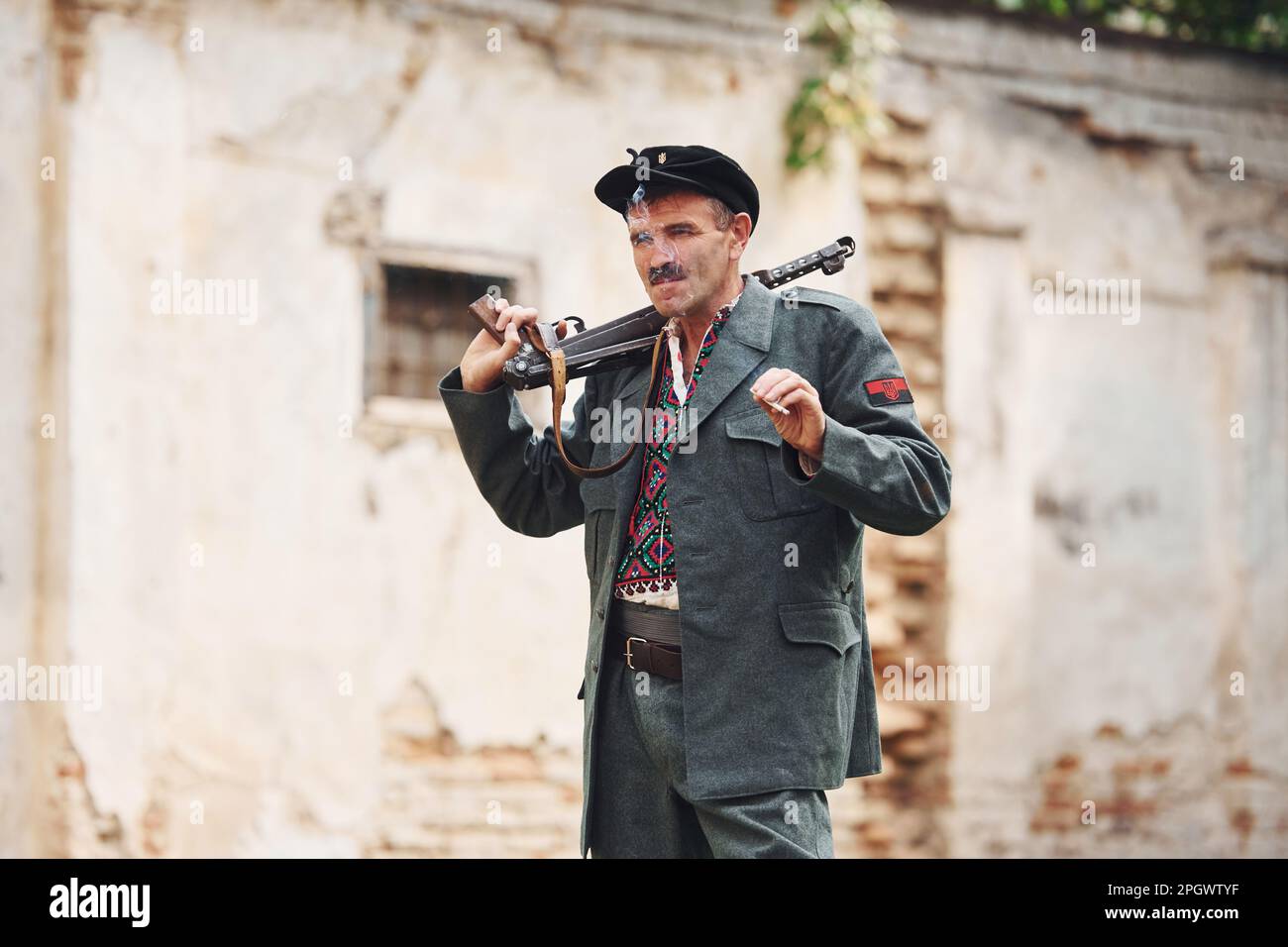 TERNOPIL, UKRAINE - June 2020 UPA Ukrainian Insurgent Army movie filming. Pictures of backstage. Old soldier with weapon smoking Stock Photo
