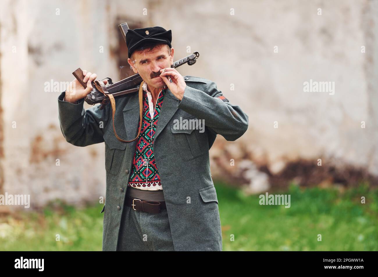 TERNOPIL, UKRAINE - June 2020 UPA Ukrainian Insurgent Army movie filming. Pictures of backstage. Old soldier with weapon smoking Stock Photo