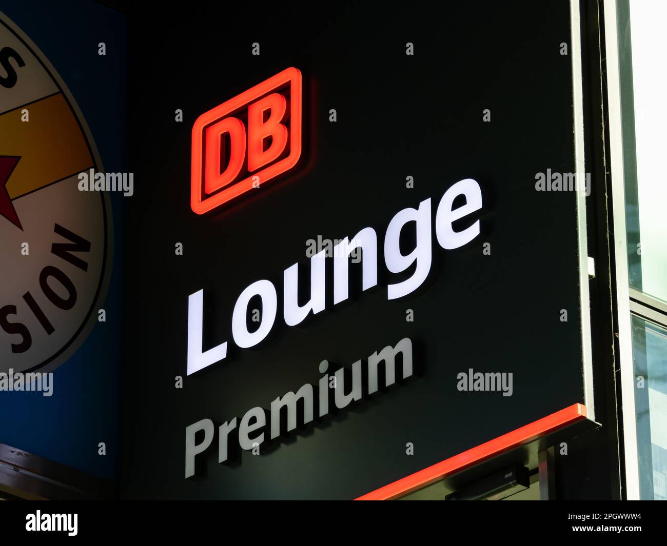 DB Lounge Premium of the Deutsche Bahn company. Comfortable waiting areas for people travelling with 1st class benefits. The logo is illuminated. Stock Photo