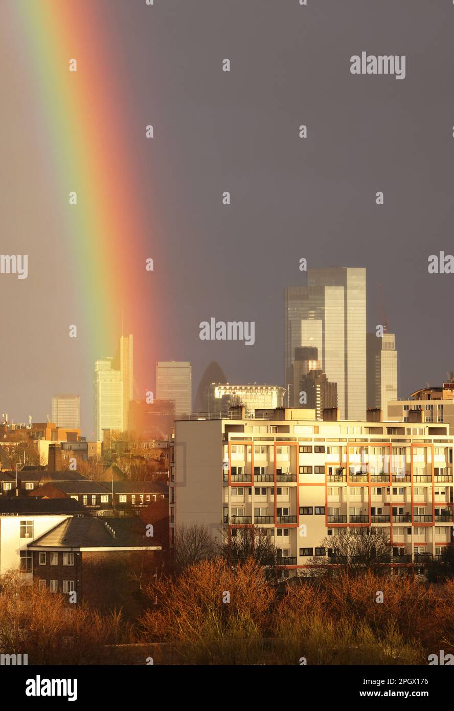 London, UK 24th March 2023. View of dramatic rainbow over the City skyscrapers, in London's unsettled weather with heavy showers and sunshine. Credit : Monica Wells/Alamy Live News Stock Photo