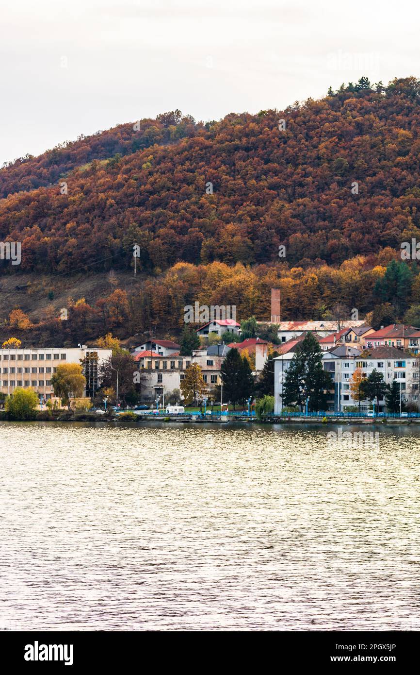 View of Danube river and Orsova city vegetation and buildings, waterfront view. Orsova, Romania, 2021 Stock Photo