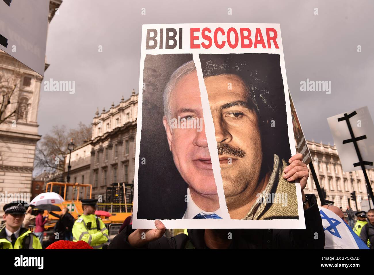 London, England, UK. 24th Mar, 2023. A poster showing half Netanyahu ...