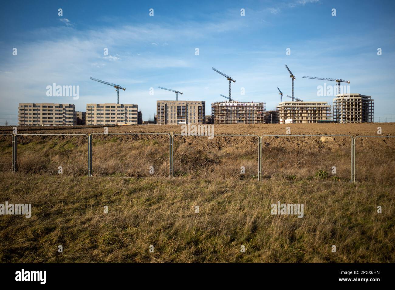 Row of new build high rise apartments under construction part of East
