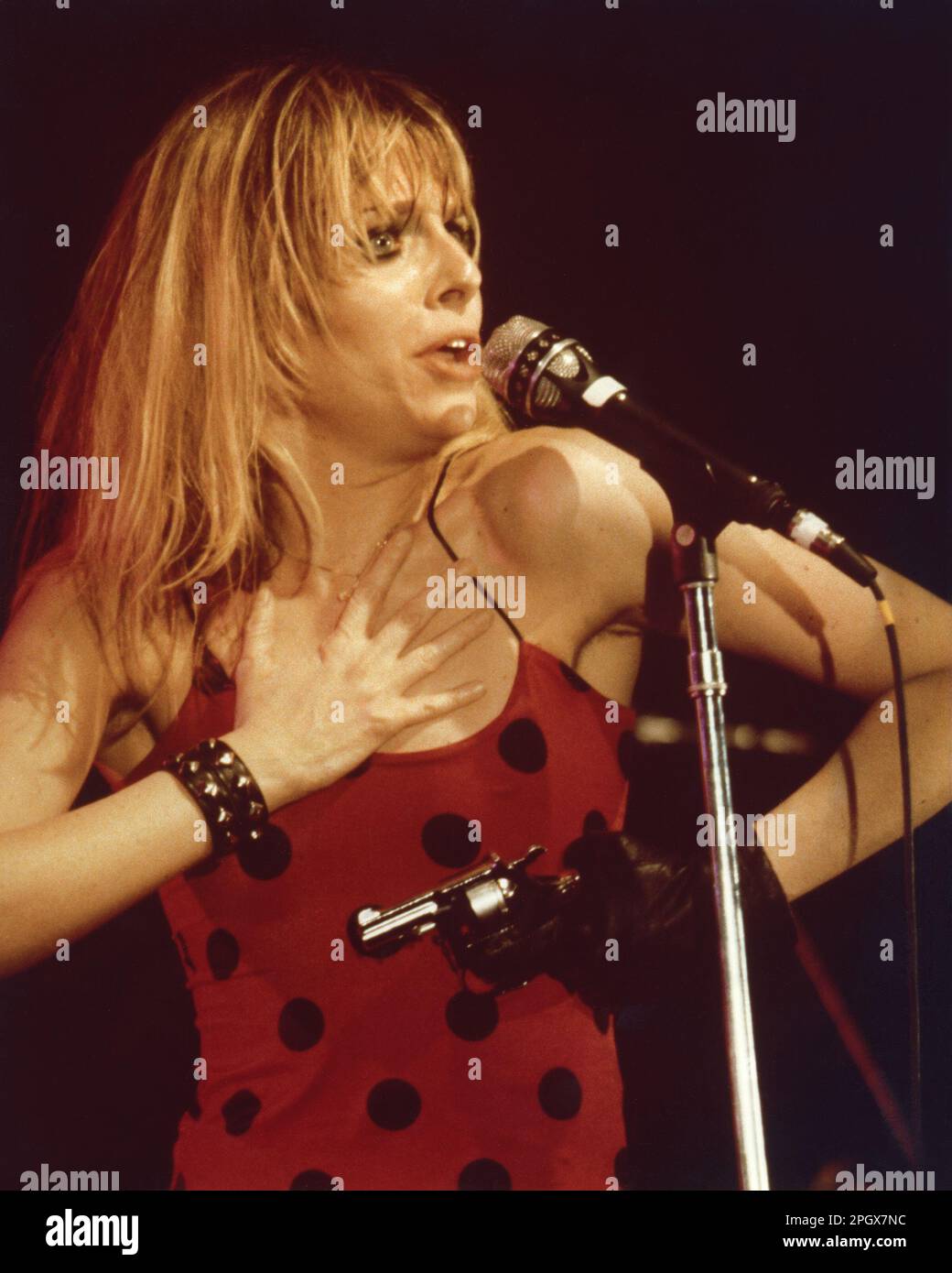 Ellen Foley with a prop pistol in concert at the Paradise Club, Boston, Massachusetts, USA