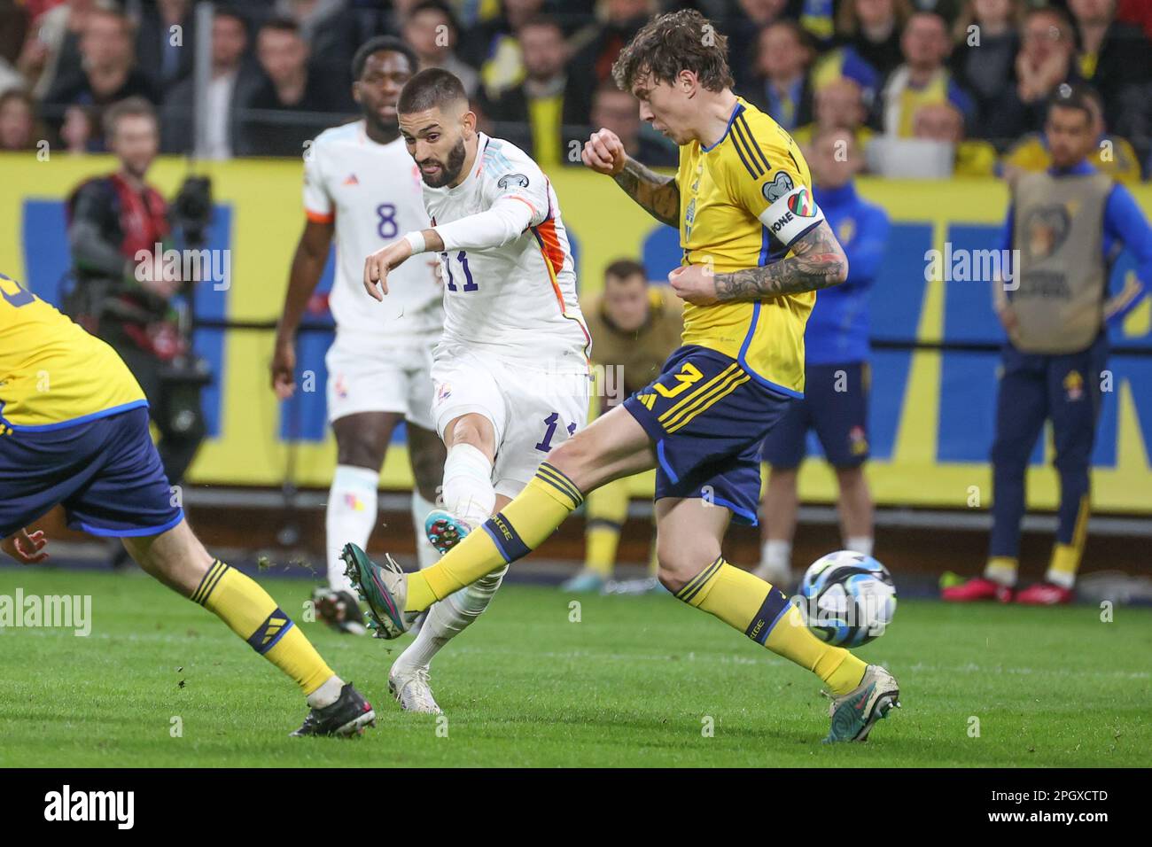 Solna, Sweden. 24th Mar, 2023. Belgium's Yannick Carrasco and Sweden's Victor Lindelof fight for the ball during a soccer game between the Swedish national team and Belgium's Red Devils, at the Friends Arena, in Solna, Sweden, Friday 24 March 2023, the first (out of 8) Euro 2024 qualification match. BELGA PHOTO VIRGINIE LEFOUR Credit: Belga News Agency/Alamy Live News Stock Photo
