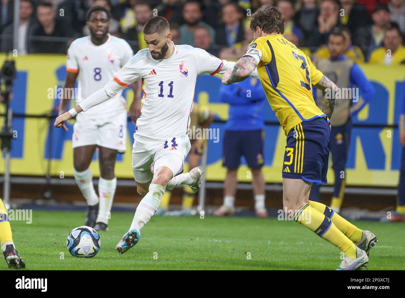 Solna, Sweden. 24th Mar, 2023. Belgium's Yannick Carrasco and Sweden's Victor Lindelof fight for the ball during a soccer game between the Swedish national team and Belgium's Red Devils, at the Friends Arena, in Solna, Sweden, Friday 24 March 2023, the first (out of 8) Euro 2024 qualification match. BELGA PHOTO VIRGINIE LEFOUR Credit: Belga News Agency/Alamy Live News Stock Photo
