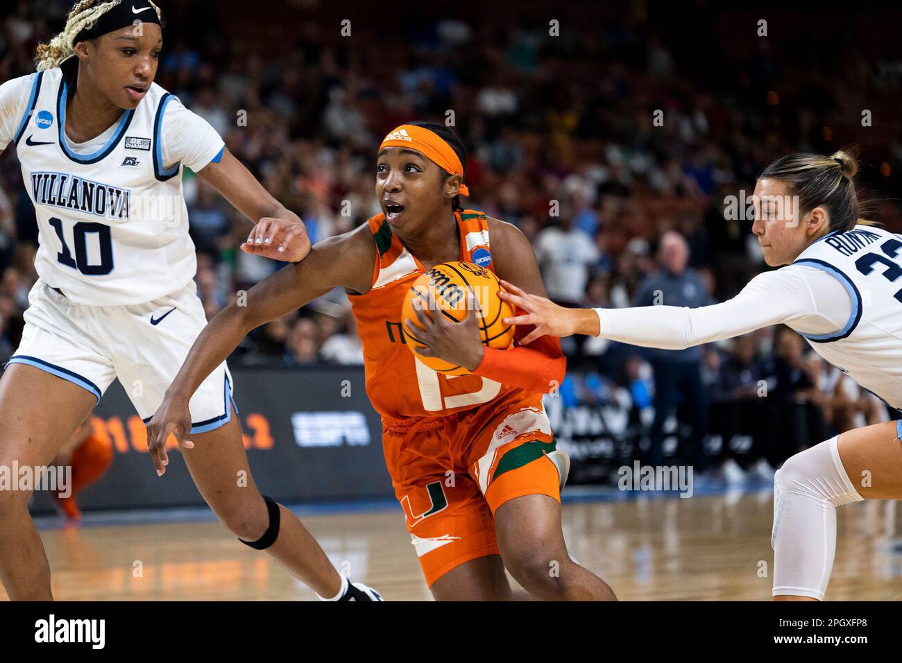 Miami's Lashae Dwyer (13) drives to the basket between Villanova's Christina  Dalce (10) and Bella Runyan (32) in the second half of a Sweet 16 college  basketball game at the NCAA Tournament