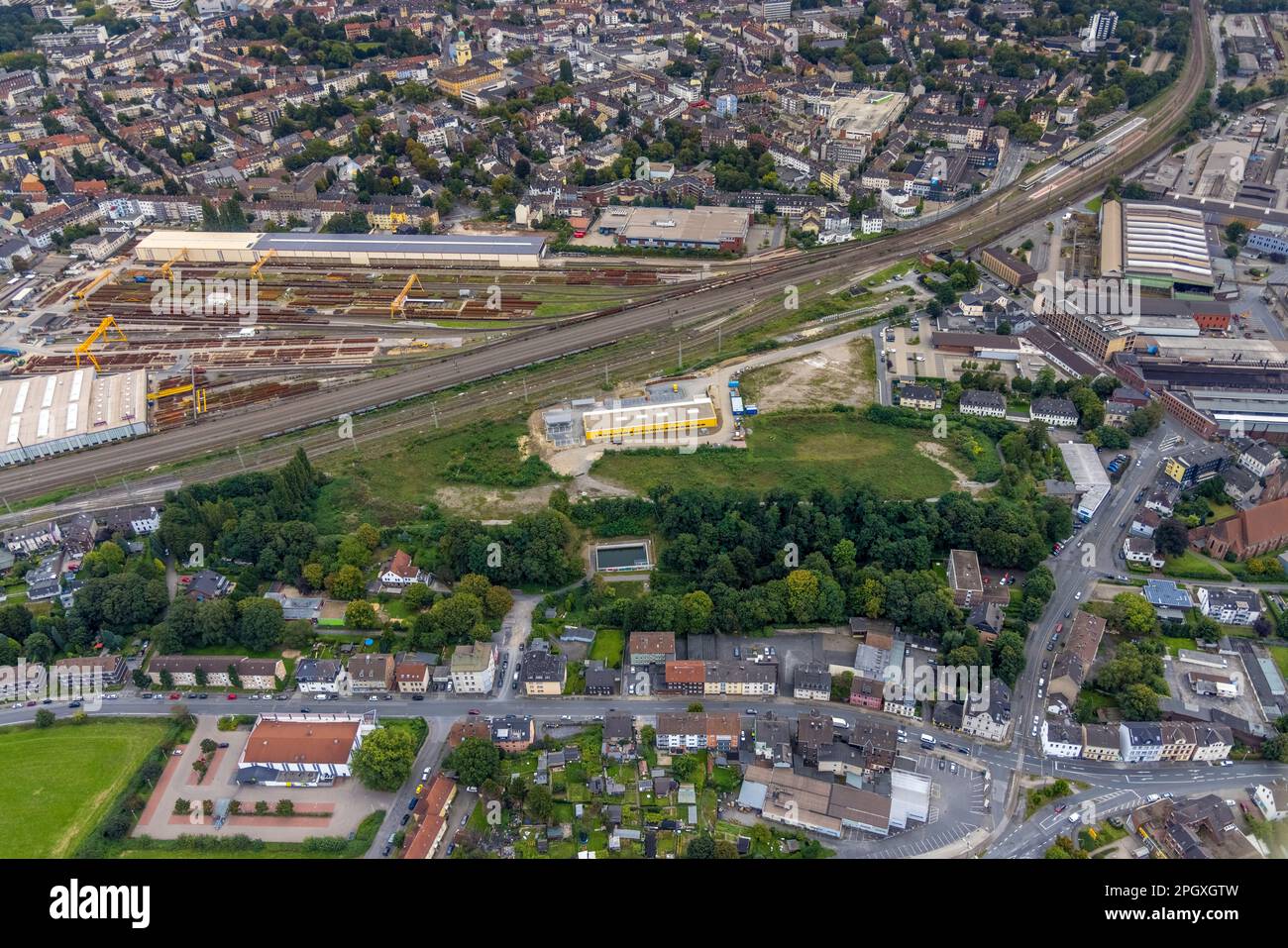Aerial view, DB-Werk Oberbaustoffe factory premises with switch straightening hall and hall with solar roof as well as Deutsche Post DHL building on t Stock Photo