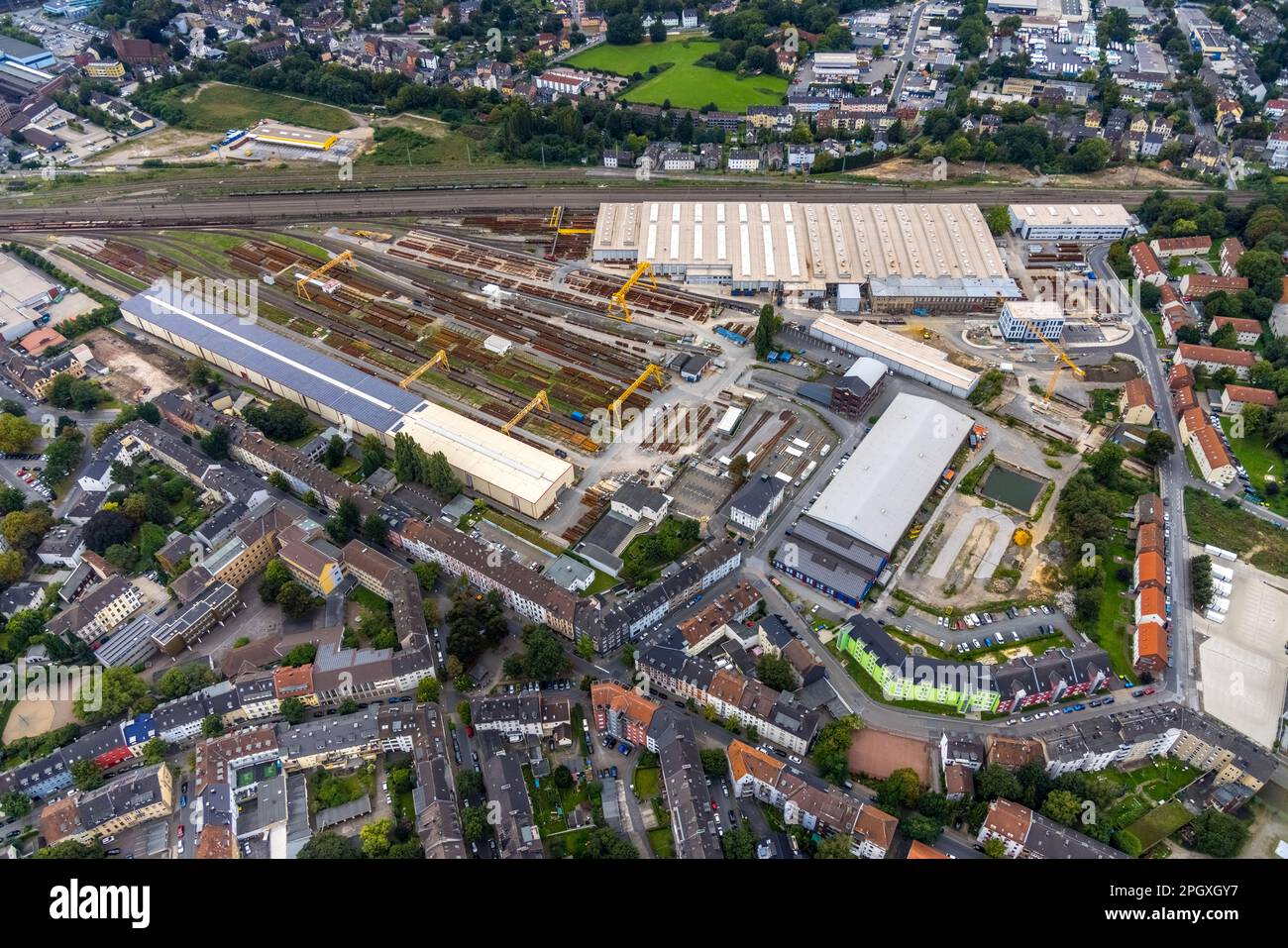 Aerial view, DB-Werk Oberbaustoffe factory premises with switch straightening hall with solar roof as well as Deutsche Post DHL building on the premis Stock Photo