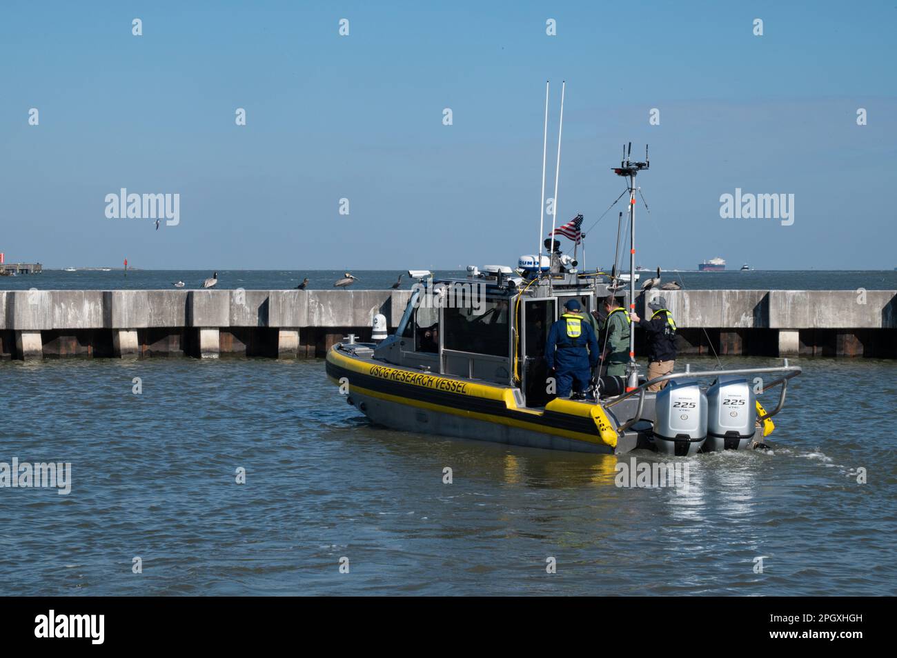 The R/V DOLPH, an autonomous vessel developed by the U.S. Coast Guard Research & Development Center (RDC), gets underway from the pier to conduct a demonstration at Coast Guard Base Galveston, Texas, Mar. 15, 2023. The R/V DOLPH is a 29-foot Response Boat-Small outfitted with a remote piloting system and has been in continuous development by the RDC with the hopes of developing a concept of operations for the integration of uncrewed surface vessels into Coast Guard missions. (U.S. Coast Guard photo by Petty Officer 3rd Class Alejandro Rivera) Stock Photo