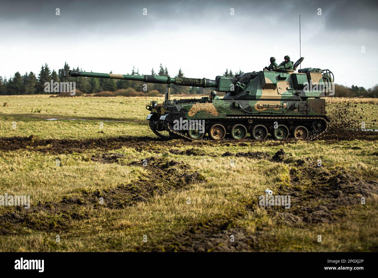 Polish soldiers assigned to the Multinational Field Artillery Brigade ...