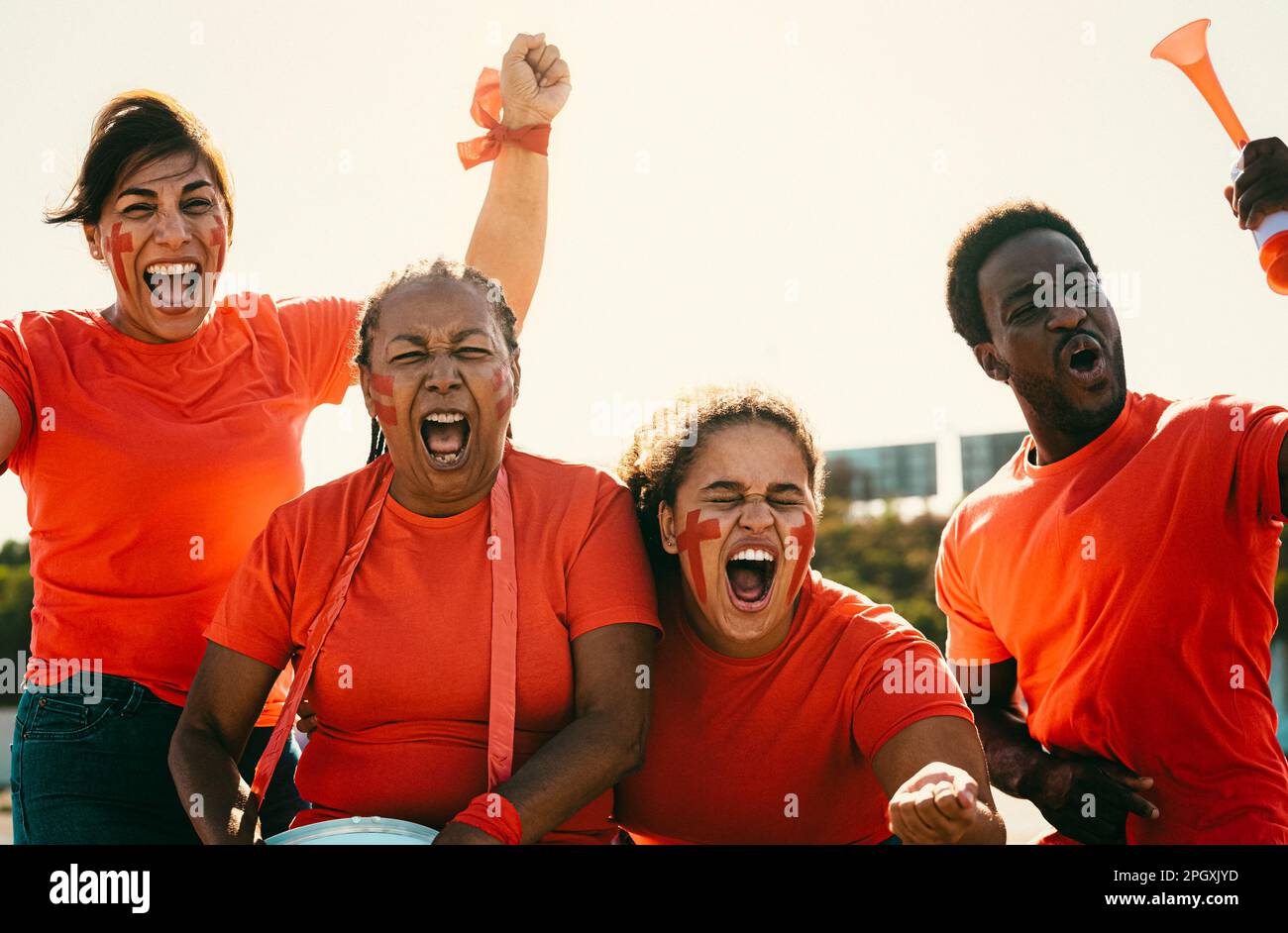 Red football fans having fun cheering their favorite team - Soccer sport entertainment concept Stock Photo