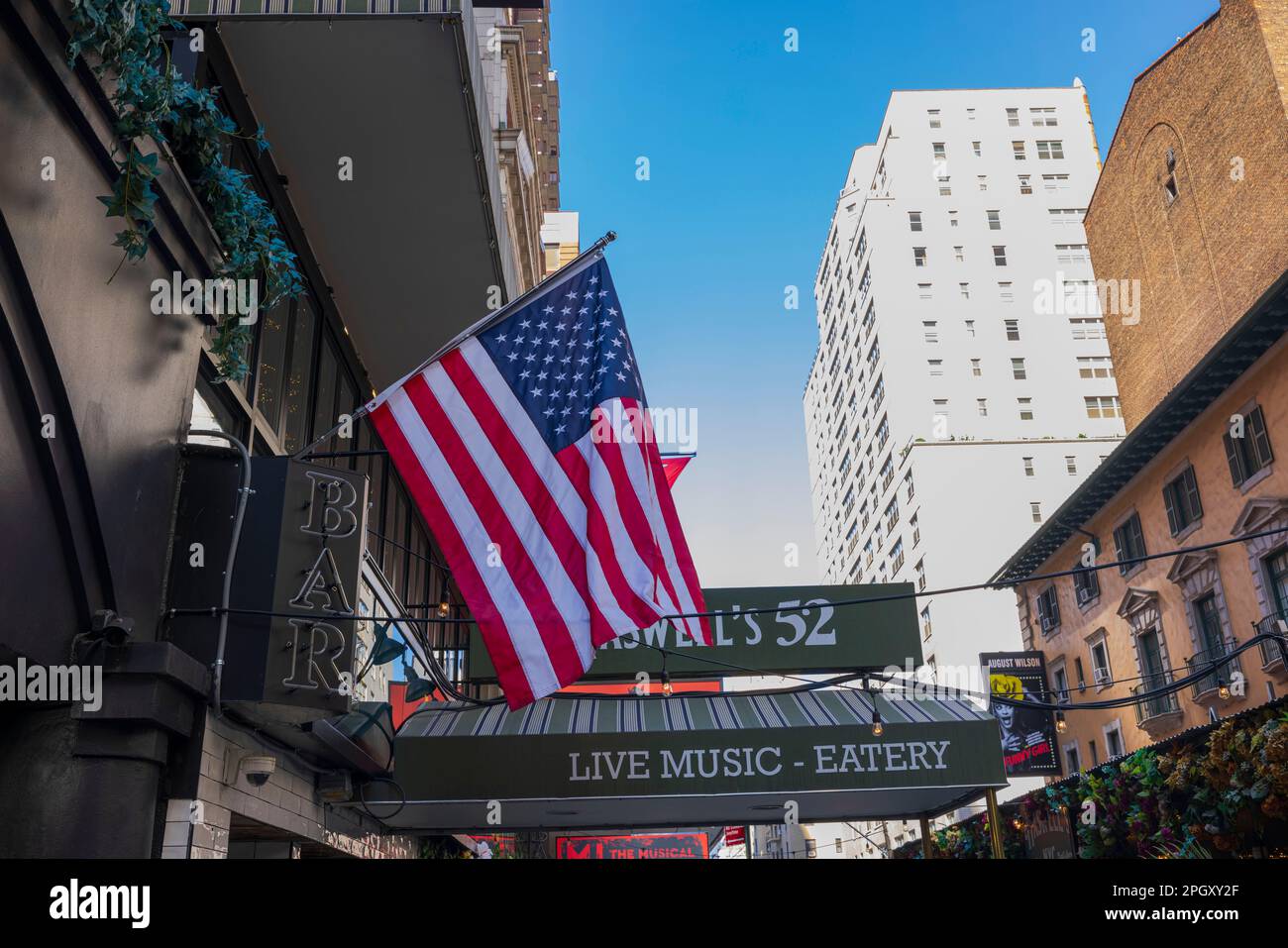 Closeup view of American flag on theater building at Neil Simon Theatre, Manhattan. NY. USA