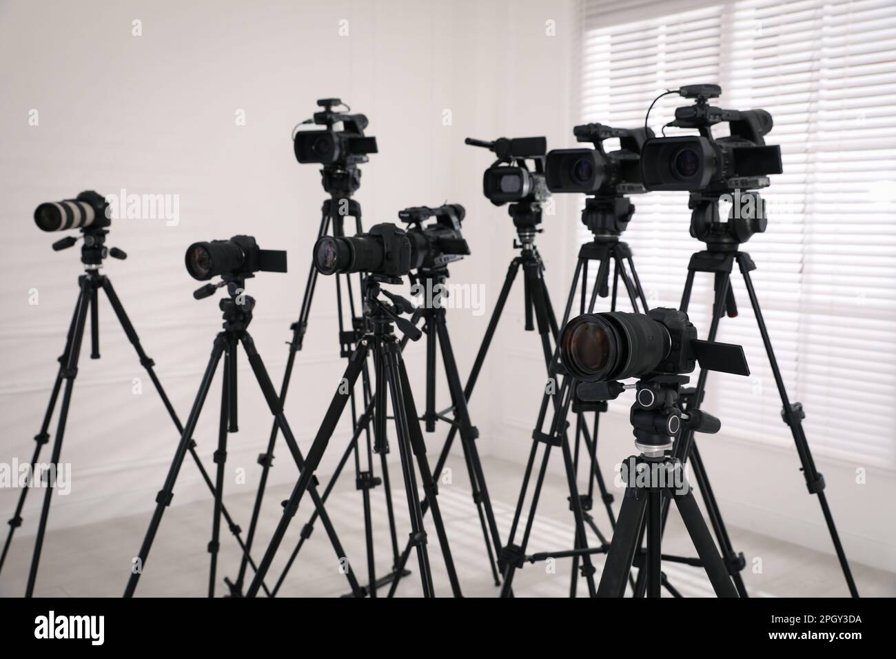 Modern video cameras indoors. Professional media equipment for broadcasting event Stock Photo