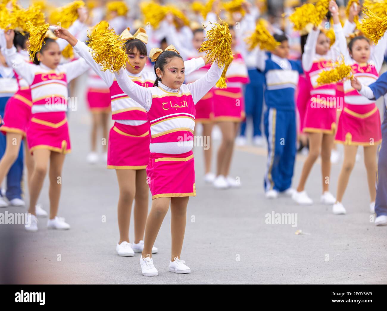 Valle Hermoso, Tamaulipas, Mexico - March 18, 2023: City Anniversary Parade, Cheerleaders from the Heroe De Nacozari primary school performing at the Stock Photo
