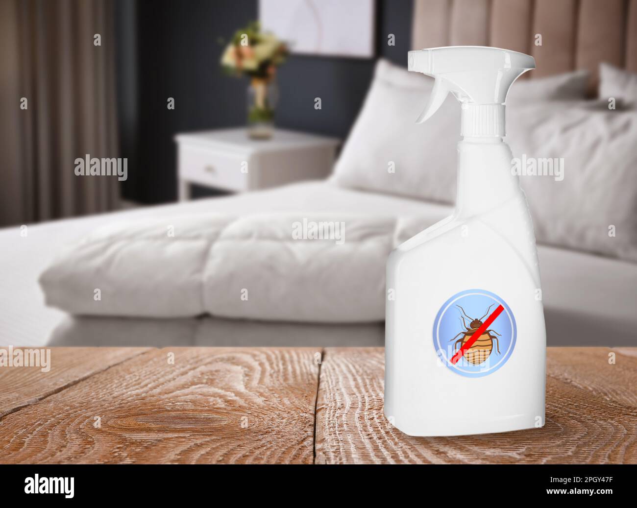 Anti bed bug spray on wooden table in bedroom. Space for text Stock Photo Alamy
