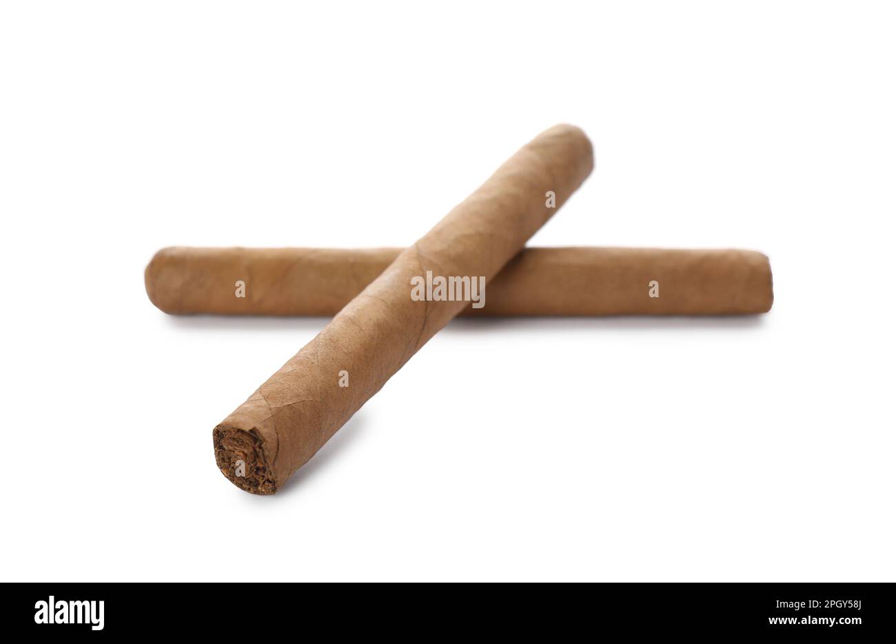 Cigars wrapped in tobacco leaves on white background Stock Photo Alamy
