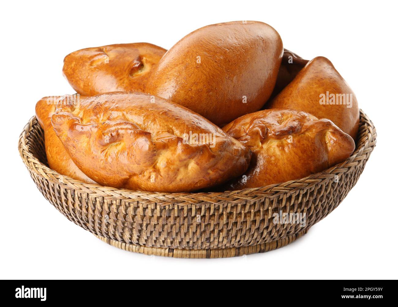 Wicker basket with delicious baked patties on white background Stock ...