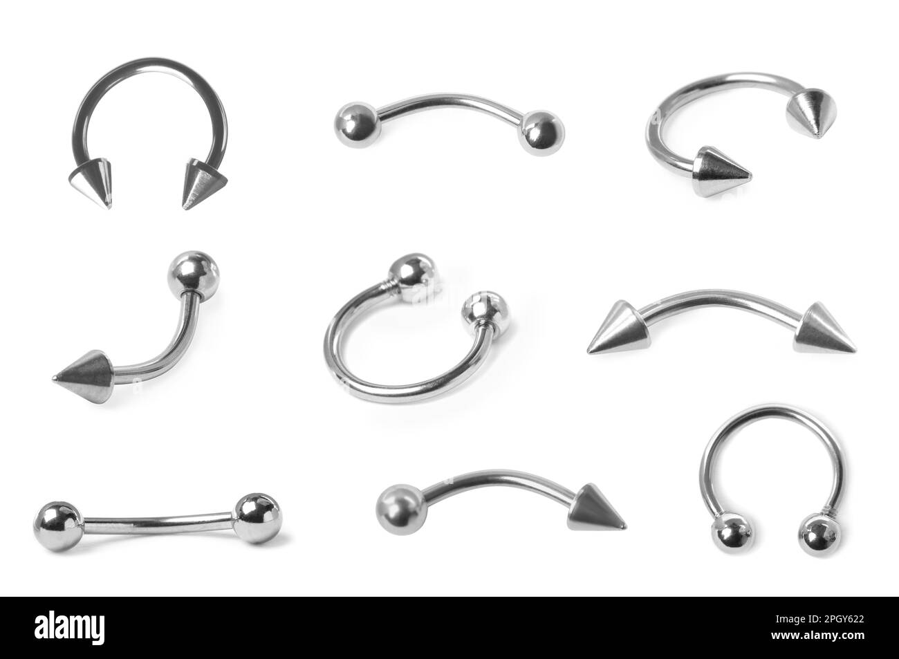 Set with different piercing jewelry on white background Stock Photo