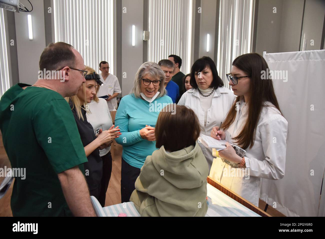 Lviv, Ukraine. 20th Mar, 2023. American surgeons examine a Ukrainian