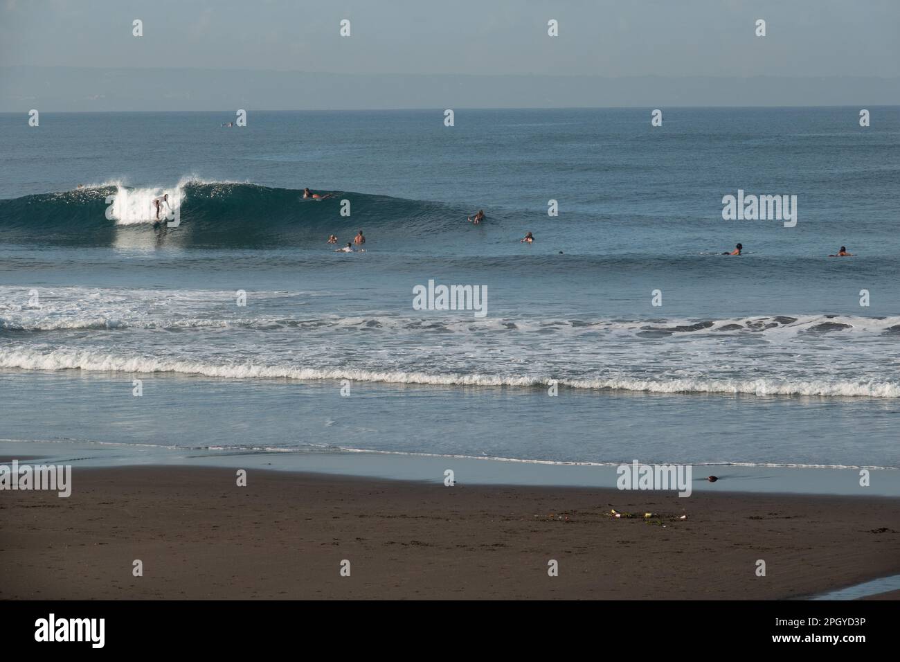 Early morning surfing crowd at popular Canggu beach, Bali, Indonesia Stock Photo