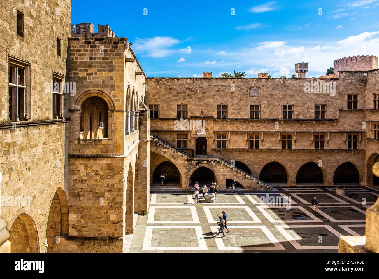 Inner courtyard surrounded by arcades with statues from Hellenistic and Roman times, Grand Masters Palace built in the 14th century by the Johnnite Stock Photo
