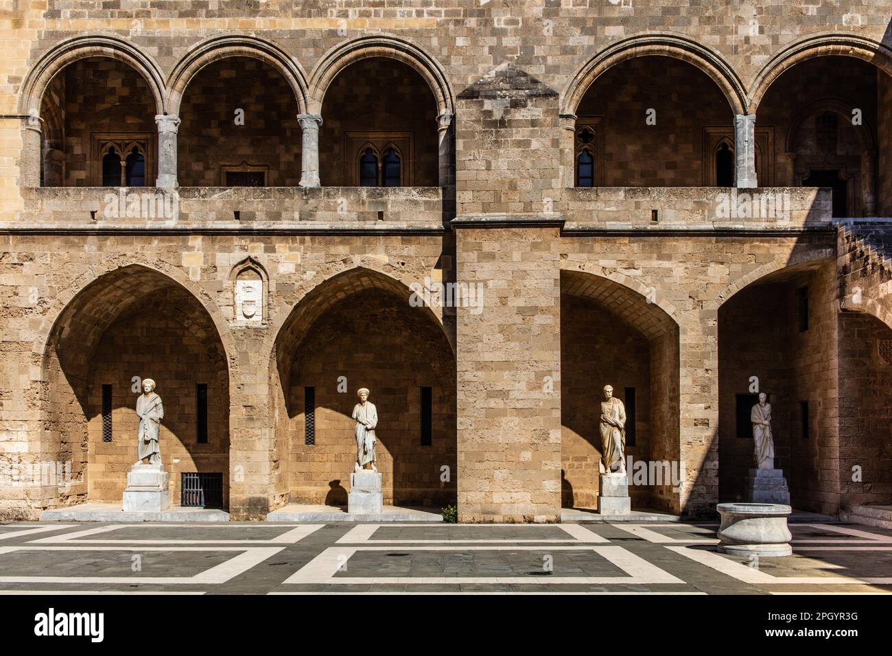 Inner courtyard surrounded by arcades with statues from Hellenistic and Roman times, Grand Masters Palace built in the 14th century by the Johnnite Stock Photo