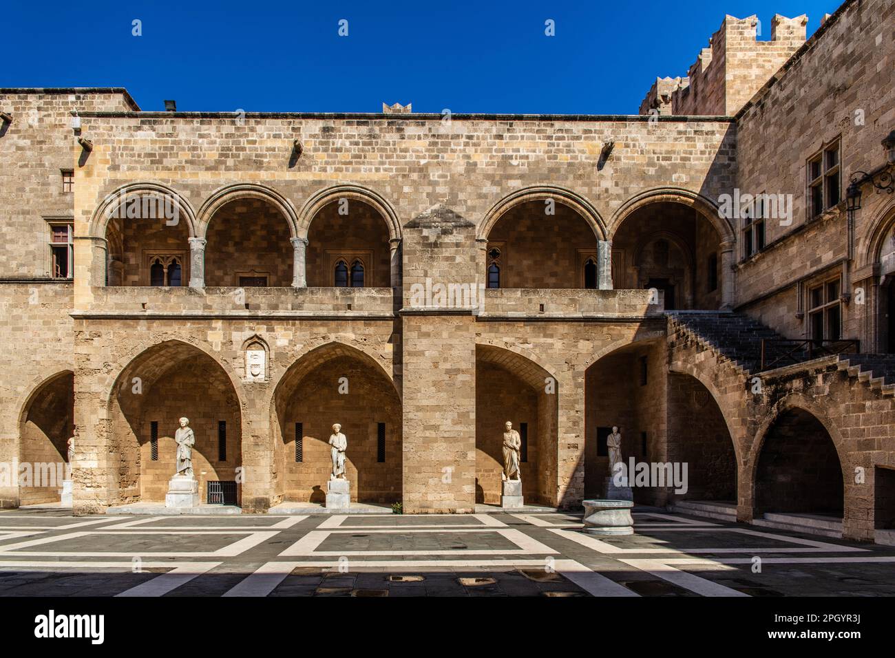 Inner courtyard surrounded by arcades with statues from Hellenistic and ...
