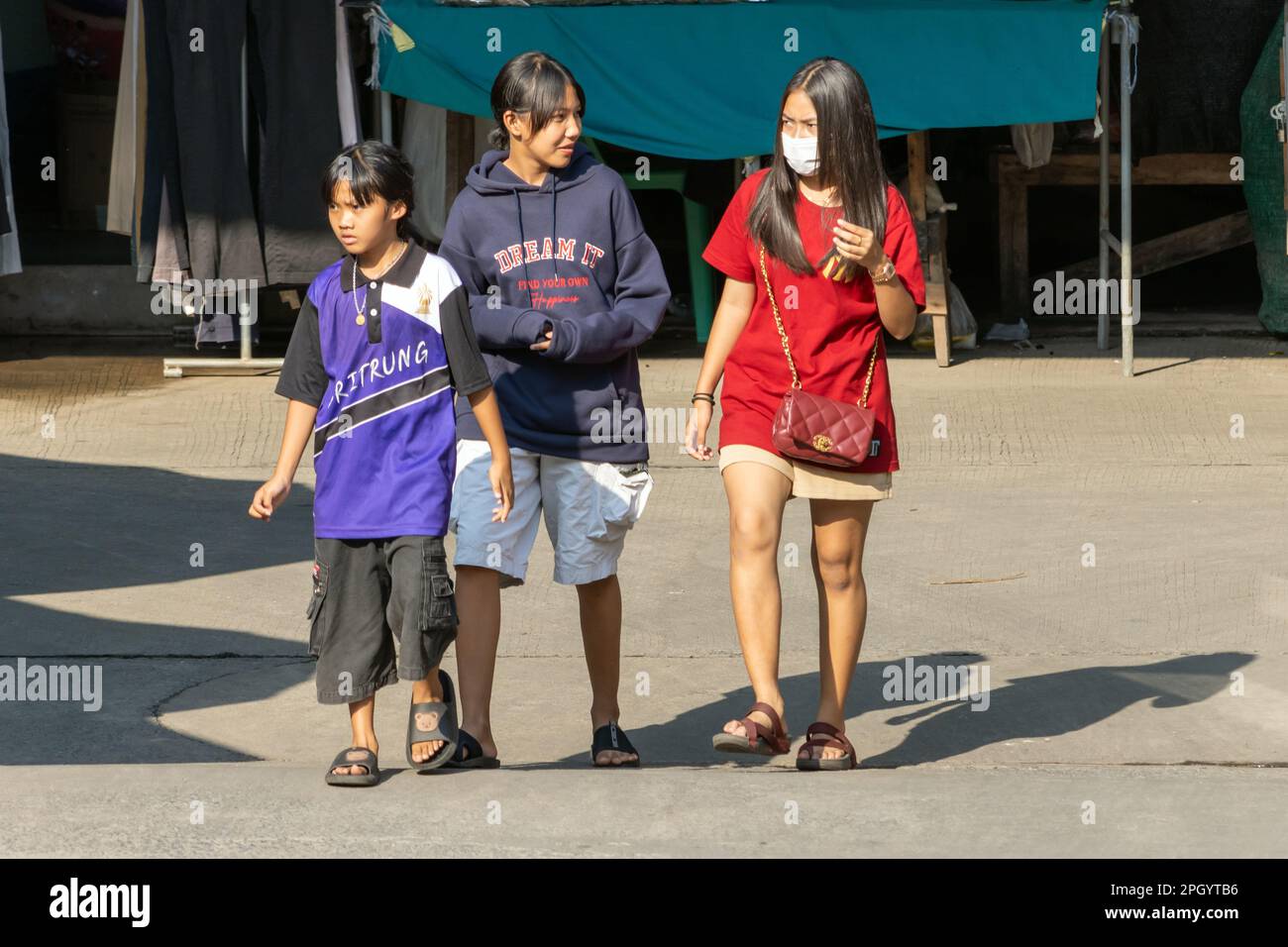 SAMUT PRAKAN, THAILAND, FEB 02 2023, A group of cheerful girls are walking along the street Stock Photo