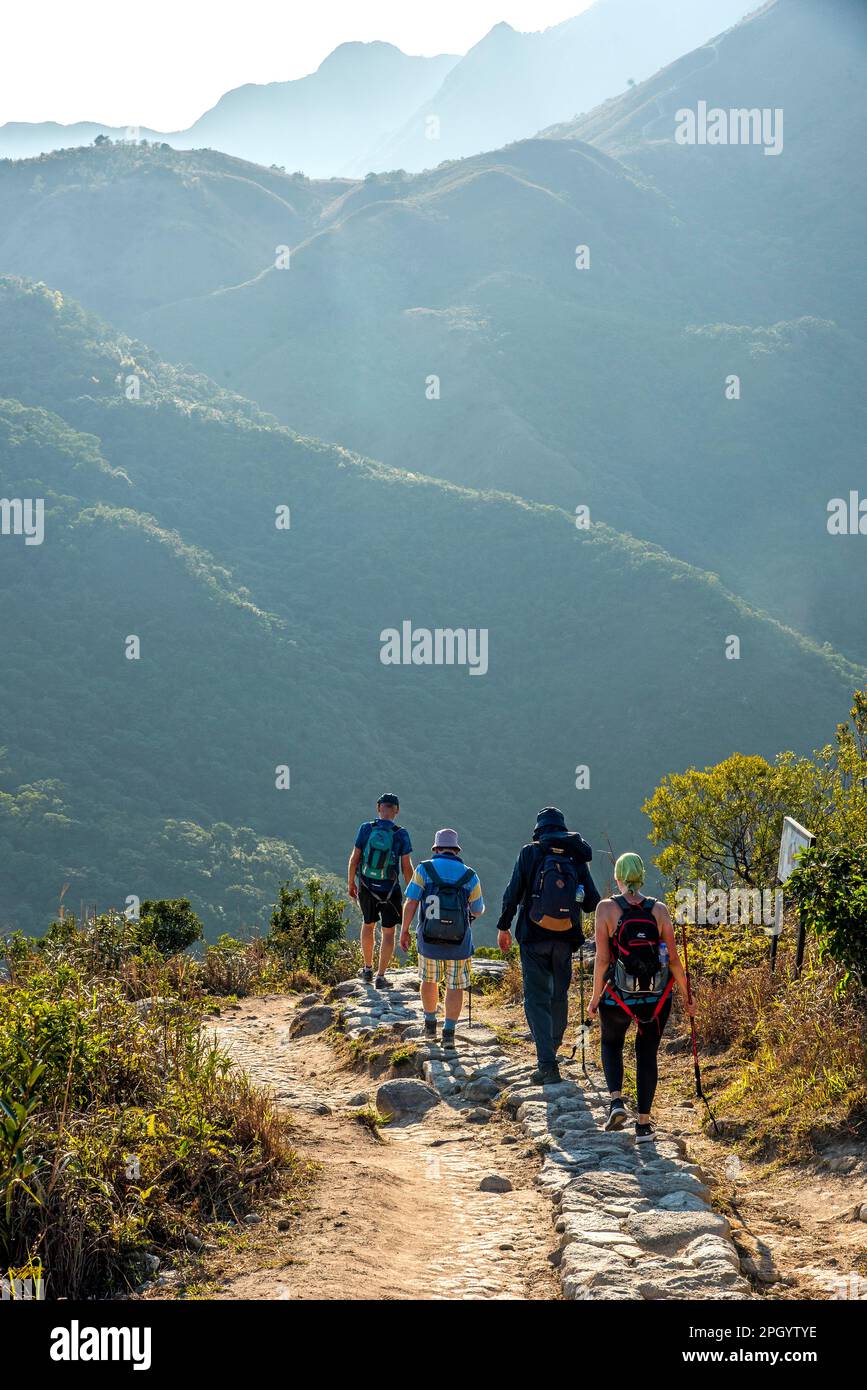 Hikers on Sunset Peak trail Lantau Island Hong Kong Stock Photo
