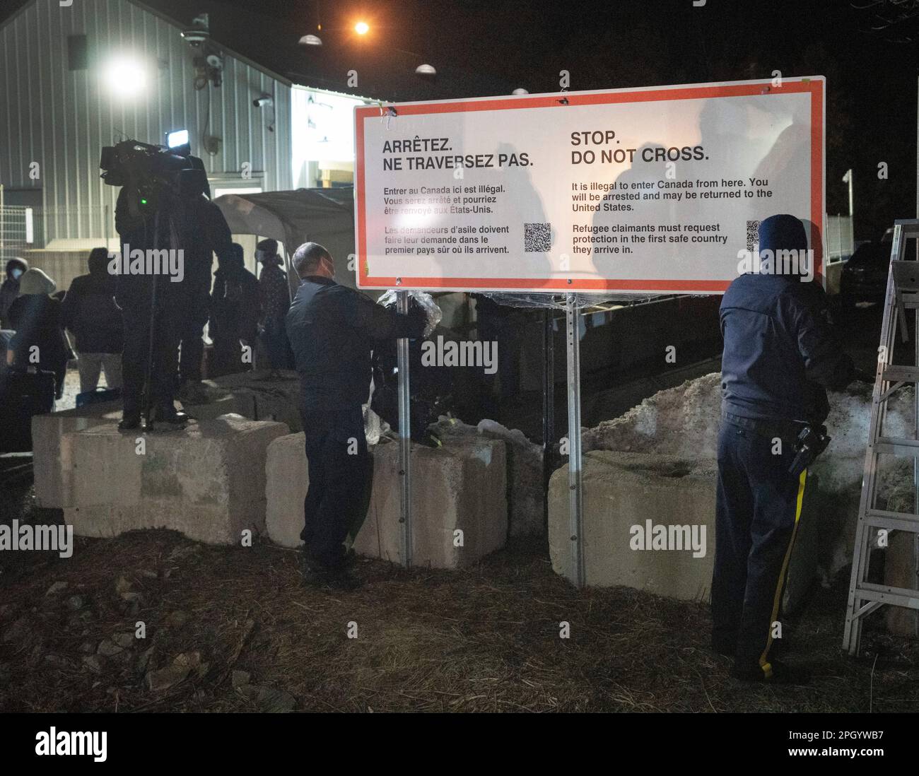 Champlain, United States. 25th Mar, 2023. RCMP officers unwrap a new