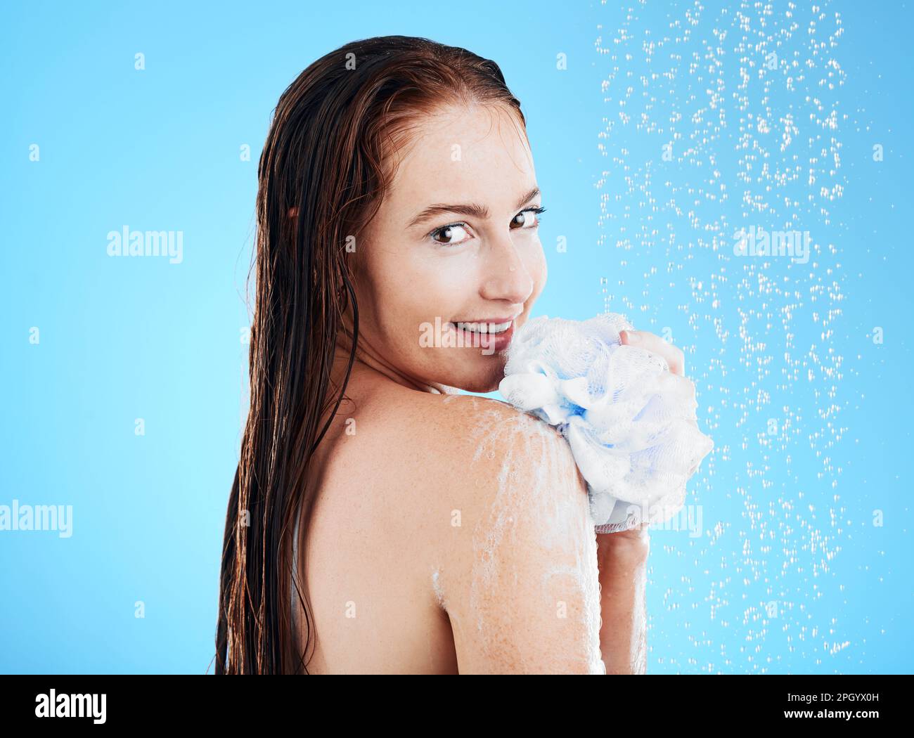 Woman in shower, portrait with sponge and soap, hygiene and water drops