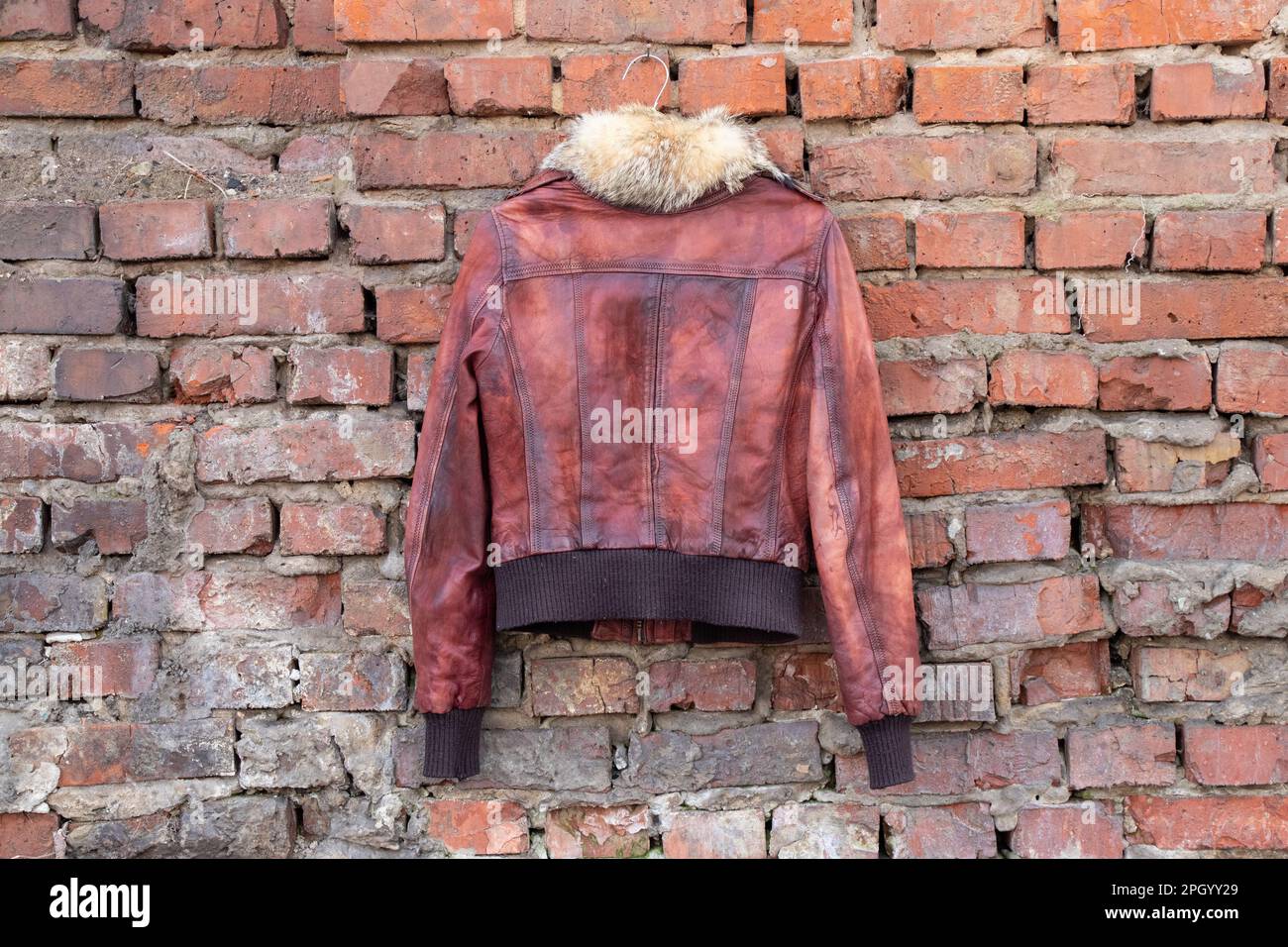 Coat hanger leather jacket hi-res stock photography and images - Alamy