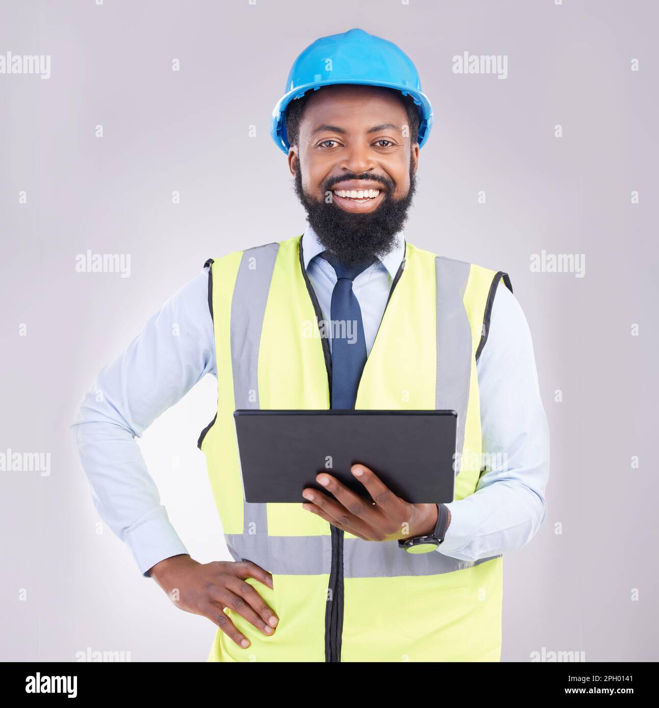 Engineering, black man and tablet in studio portrait with smile, architecture and building design. Male architect, mobile touchscreen or excited face Stock Photo