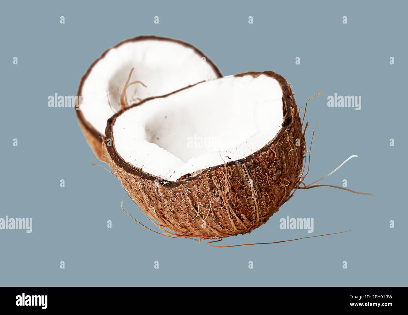 Coconut halves. Cut pieces, crosssection of open coco nut fruit Stock