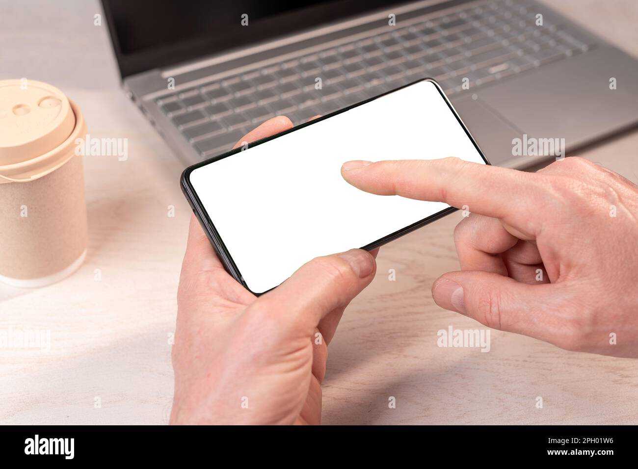 Finger pressing play, touching screen on mobile phone mockup, smartphone display mock-up for watching video. Stock Photo